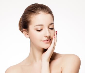 Dr Gerald N. Bock, MD California Skin & Laser Center Woman putting her hand on her face