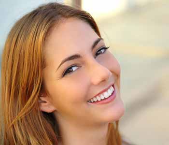 Dr Gerald N. Bock, MD California Skin & Laser Center Smiling Woman Side Look